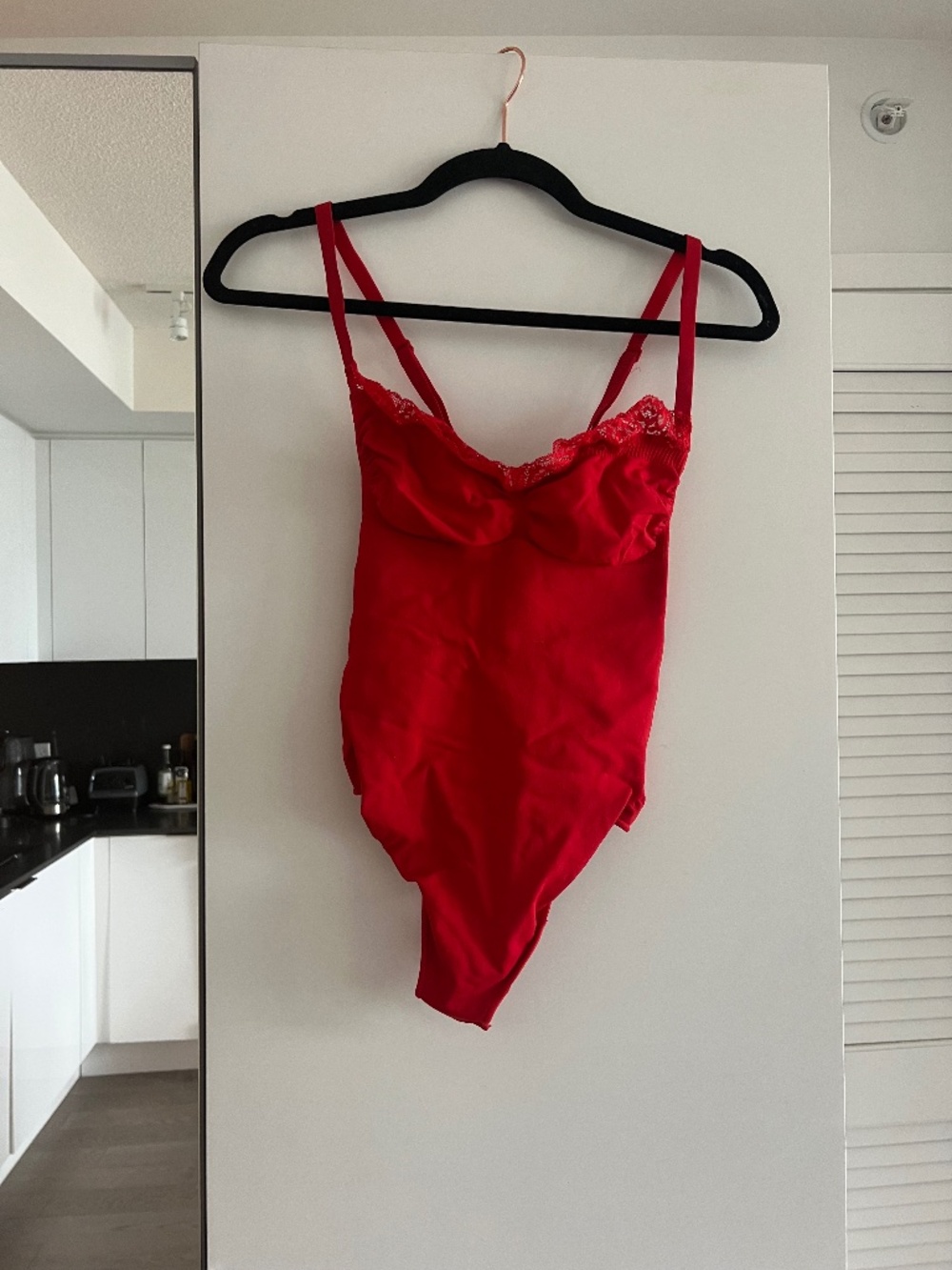 SKIMS sculpting bodysuit in red